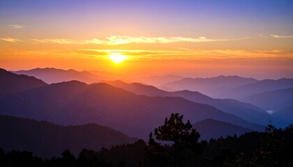 A vibrant sunset over a layered mountain range, casting a warm glow on the landscape.