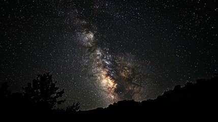 Fototapeta premium Milky Way over Silhouetted Hills