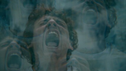Young man screaming in intense mental anguish, experiencing psychotic episode in asylum ward. Kaleidoscope effect - Powered by Adobe