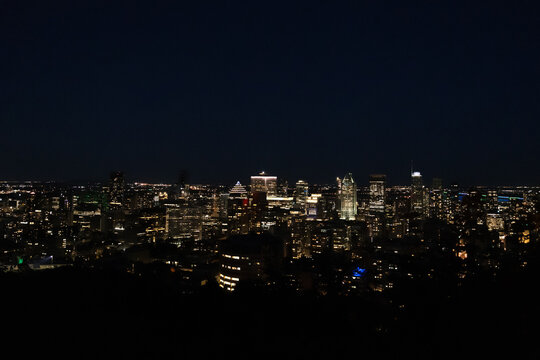 Stunning night view of the Montréal skyline illuminated with city lights.