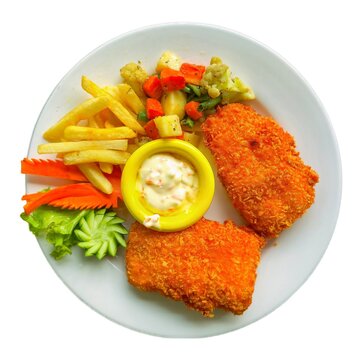 Fish fillets with sauce and boild vegetables