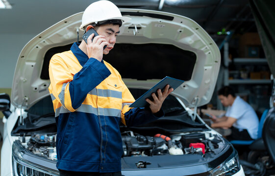 Asian male automotive technician who inspects, repairs, and maintains all vehicle systems,ensuring safe and optimal performance through expertise in engines, brakes, transmissions electrical systems