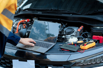 Asian male automotive technician who inspects, repairs, and maintains all vehicle systems,ensuring safe and optimal performance through expertise in engines, brakes, transmissions electrical systems