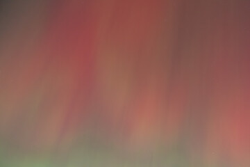 Breathtaking display of multicolored Northern Lights glowing over the landscape.