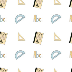 Seamless pattern with rulers, a notebook and abc