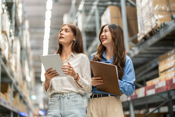 Asian warehouse staff teamwork, supply chain logistics management, shipping inventory check with...