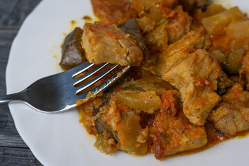 Tasty Stewed Pork with Eggplant and Tomatoes on a Plate