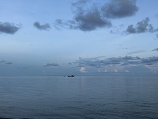 Serene Ocean Landscape Under Cloudy Sky