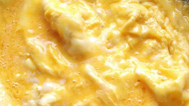 Spatula to stir the eggs for scrambled eggs in the hot pan.