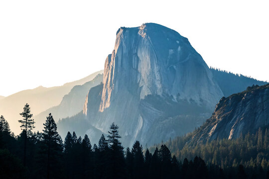 Half Dome granite cliff formation in Yosemite with surrounding forest and golden sunset light, isolated on a transparent background