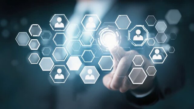 Strategic Touchpoint: A futuristic digital interface features a close-up of a person's finger as they navigate and interact with an abstract network of connected user icons, symbolizing networking.