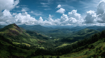 Fototapeta premium Scenic wide-angle view showcasing lovely skies, lush hills, and mountains