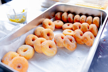 Sugar‑Coated Mini Doughnuts in Metal Tray Setup