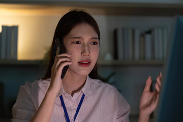 Stressful Situation. Young woman on phone, expressing concern in modern office.