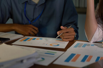 Team Collaboration in Office. Professionals analyzing financial reports together.