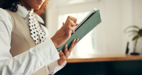 Hands, tablet and woman in reception for hotel booking, concierge and guest check in. Hospitality...