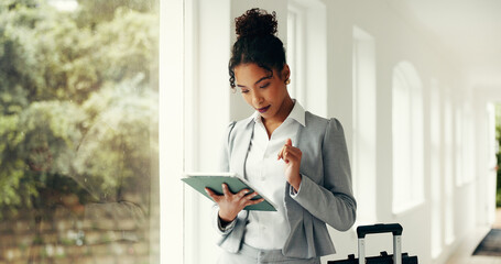 Business woman, travel and tablet with luggage for flight departure or schedule in hallway. Female...