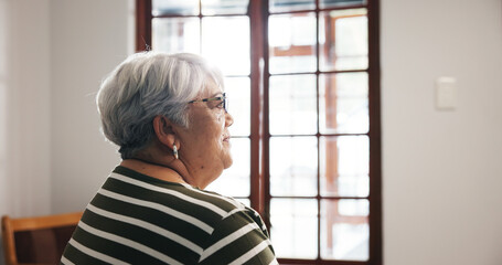 Thinking, elderly woman and smile at house with dementia, memory loss and nostalgia thoughts. Sad,...