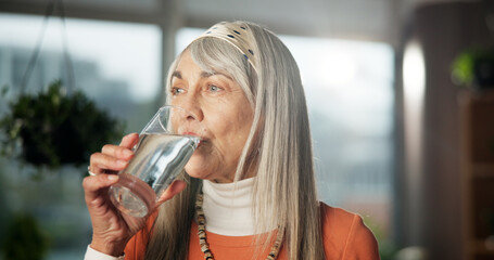 Home, senior woman and drinking water for health, nutrition or wellness benefits. Glass, hydration...