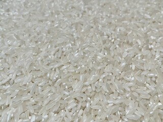 White rice background. A close - up shot of white long - grain rice, highlighting its smooth and translucent grains. Perfect for food, cooking, and agricultural projects.
