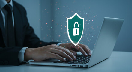 man typing on a laptop with a digital shield and padlock overlay, representing cybersecurity, data protection, and online privacy. secure your digital world with the latest technology. 