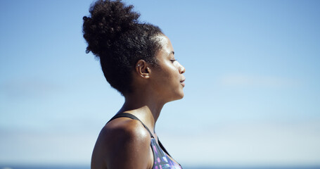 Woman, peace and thinking in nature for fitness, meditation and fresh air for wellness. African...