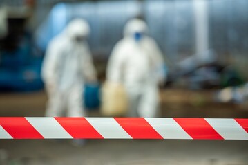 Man inspector scientist investigate chemical gas leak spill with safety face mask PPE suit in area...