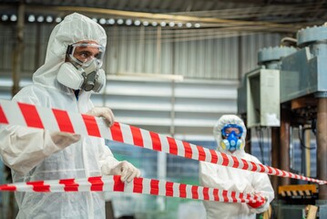 Man inspector scientist investigate chemical gas leak spill with safety face mask PPE suit in area...