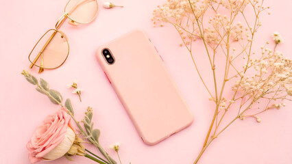 Aesthetic Flat Lay Featuring a Pink Phone Case and Delicate Floral Elements on a Pink Background