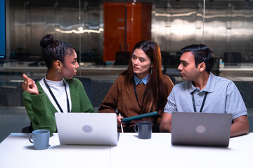Programmer office code developer laptop discussion teamwork meeting collaboration technology communication