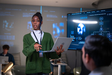Confident businesswoman leading a diverse team of professionals in corporate boardroom, brainstorming business strategy analyzing financial data, and discussing startup growth and leadership success