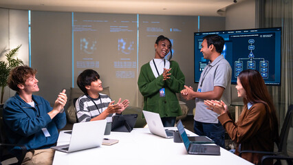 Programmer office developer code meeting collaboration teamwork discussion technology presentation smiling happy diverse people working together in modern workspace
