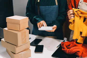Portrait of Starting small businesses SME owners, two Asian woman check online orders Selling...