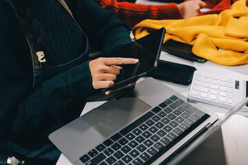 Portrait of Starting small businesses SME owners, two Asian woman check online orders Selling...
