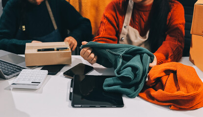 Portrait of Starting small businesses SME owners, two Asian woman check online orders Selling...
