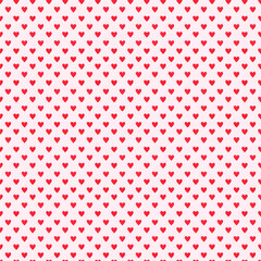 Seamless pattern of small red hearts on a soft pink background. Ideal for romantic design, textiles, or decorative projects.