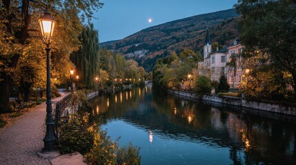 Fototapeta premium Scenic riverside promenade with glowing streetlights and calm water reflecting a twilight sky and distant hills perfect for travel promotions, peaceful evening visuals and landscape design