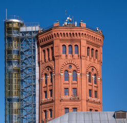 Fototapeta premium An old brick water tower against the sky.