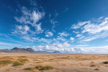 Vast, arid landscape under a vibrant blue sky