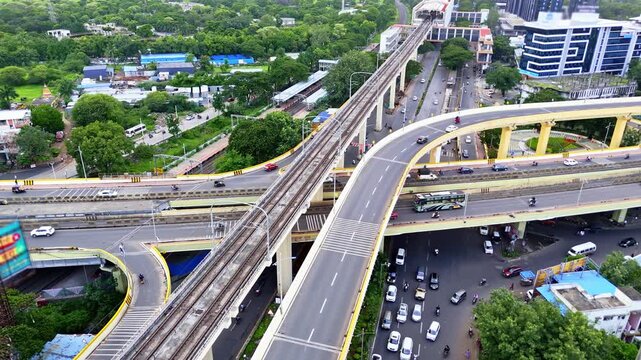 Aerial shot tiered flyovers crossing Bangalore cityscape