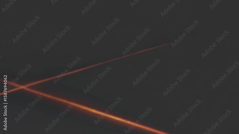 Poster abstract glowing lines crossing, creating an x shape against a dark background. the lines have a war