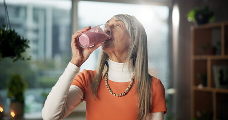 Smoothie, home and mature woman with drink for gut health, benefits or wellness in morning....