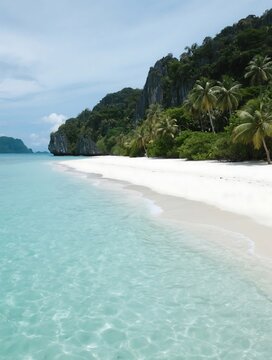 White sand and crystal clear waters of Onuk Island in Balabac, Palawan, Philippines