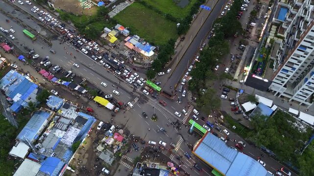Aerial View of Crowded Suburban Intersection with Vehicles