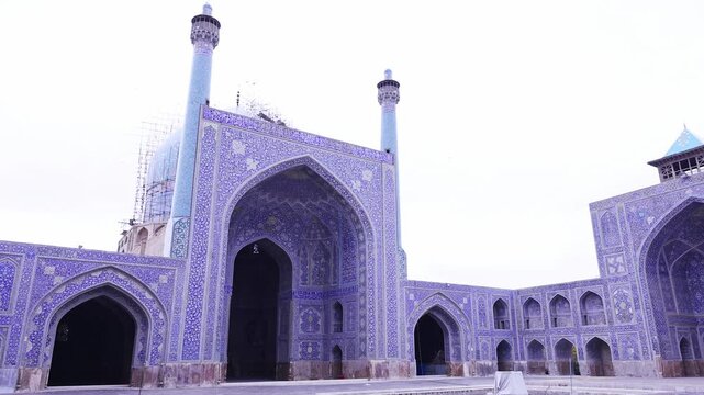 Arch at the entrance, Naghsh-e Jahan Square, Isfahan, Iran. Beautiful oldest iranian mosque interior design. Unique mosaics and ornaments. A masterpiece of Persian architecture