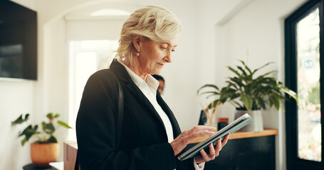 Business woman, tablet and lobby at hotel for trip schedule, contact or typing at luxury...