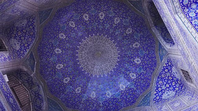 Ceiling at Imam Mosque, arch at the entrance, Naghsh-e Jahan Square, Isfahan, Iran. Beautiful oldest iranian mosque interior design. Unique mosaics and ornaments. A masterpiece of Persian architecture