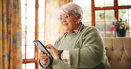 Senior woman, scroll or phone on sofa for online news, playing word search or reading ebook....