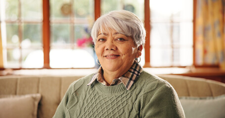 Elderly woman, happy and portrait on sofa in lounge with pride, confident or relax in retirement...