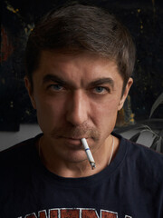 Intense Gaze: Man with Cigarette and Mustache